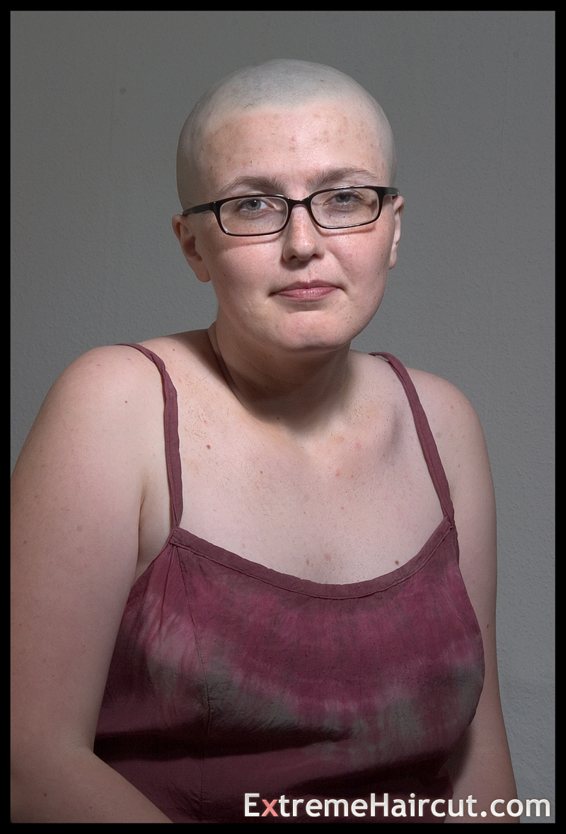 bald girl with glasses